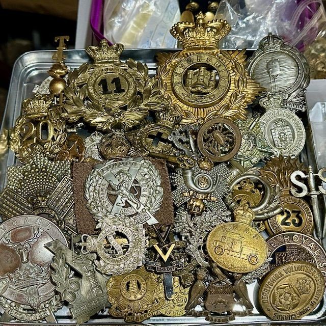 ***New In***Large Helmet Plate and Cap Badge Collection.